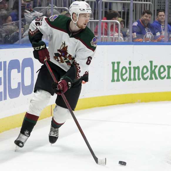 Arizona Coyotes defenseman Janis Moser (62) skates around the goal during the second period of the team&#039;s NHL hockey game against the New York Islanders, Friday, Jan. 21, 2022, in Elmont, N.Y. (A ...
