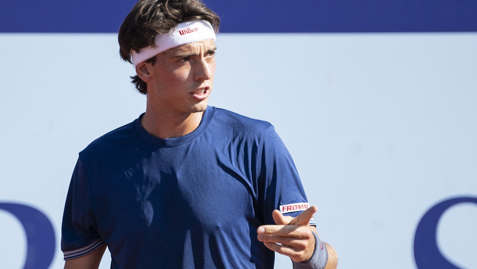 Marc-Andrea Huesler of Switzerland reacts to Denis Istomin of Uzbekistan during a first round game at the Swiss Open tennis tournament in Gstaad, Switzerland, Tuesday, July 23, 2019. (KEYSTONE/Peter S ...