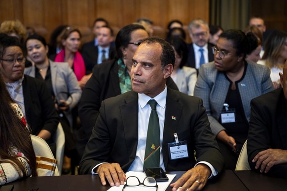 epa12256122 Ralph Regenvanu, Minister of Climate Change of Vanuatu, attends the International Court of Justice for a pronouncement of an opinion on countries' obligations to protect the climate,  ...