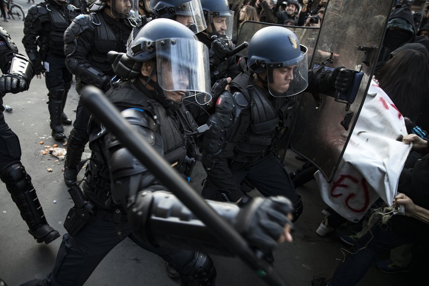 epa05802097 French riot police clashes with protesters during a demonstration to support Theo and against police violence in Paris, France, 18 February 2017. Theo, a young man, was hospitalised for an ...