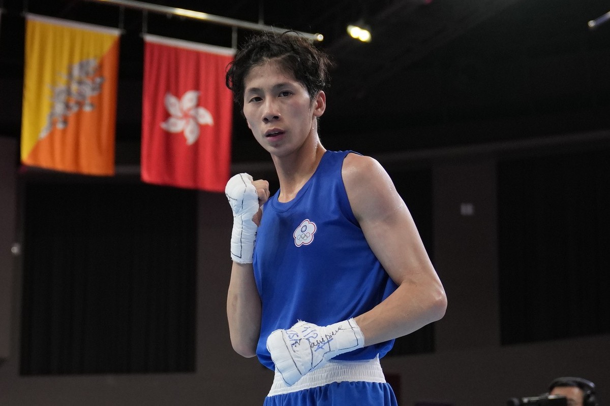 FILE - Taiwan's Lin Yu-ting poses after winning against India's Parveen in the Boxing Women's 54-57Kg Semifinal bout during the 19th Asian Games in Hangzhou, China, Wednesday, Oct. 4, 2 ...