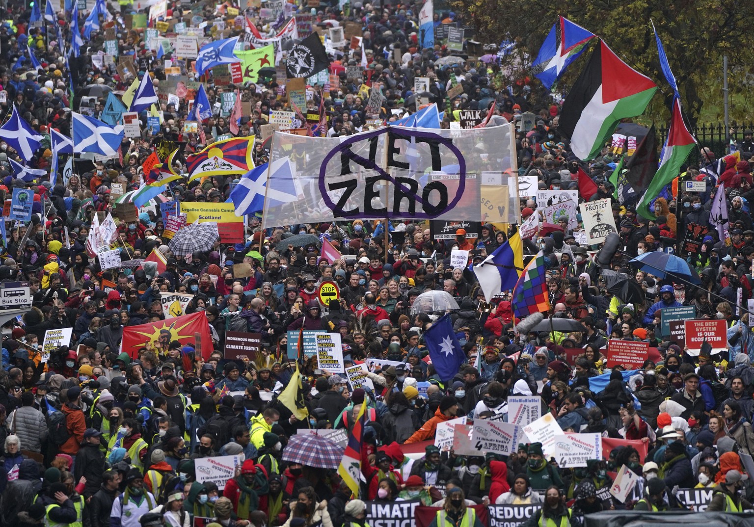 Climate activists attend a protest organized by the COP26 Coalition in Glasgow, Scotland, Saturday, Nov. 6, 2021. The protest was taking place as leaders and activists from around the world were gathe ...