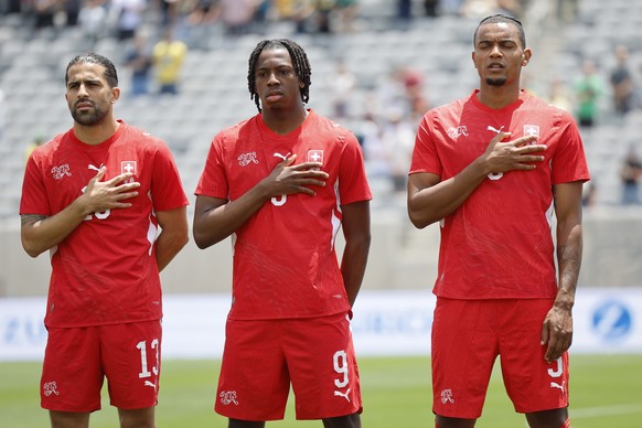 Switzerland's Ricardo Rodriguez, Johan Manzambi and Manuel Akanji, from left, sing the national anthem prior to a friendly soccer match between Switzerland and Australia at the Snapdragon Stadium ...