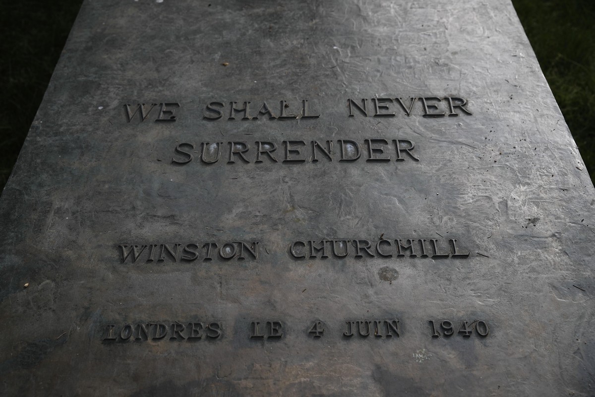 The basement of Britain's wartime Prime Minister Winston Churchill's statue is engraved with his famous sentence, Friday May 8, 2020 in Paris. The 75th anniversary of the end of World War II ...