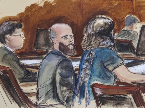 FILE - In this courtroom sketch, Joshua Schulte, center, is seated at the defense table flanked by his attorneys during jury deliberations, Wednesday March 4, 2020, in New York. Schulte, the former CI ...