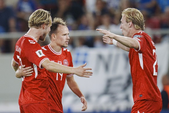 epa12363154 Denmark&#039;s Mikkel Damsgaard (C) celebrates with Mika Biereth (R) and Morten Hjulmand after scoring the 0-1 goal during the FIFA World Cup 2026 qualifier soccer match between Greece and ...