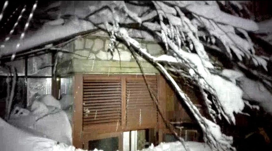 epa05729901 A handout picture provided by rescuers shows the hotel Rigopiano after it was hit by an avalanche in Farindola (Pescara), Abruzzo region, early 19 January 2017. According to an Italian mou ...