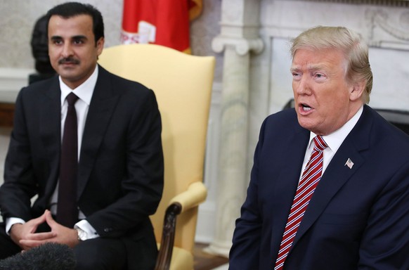 epa06659898 US President Donald J. Trump speaks during a meeting with the Emir of Qatar Sheikh Tamim bin Hamad Al Thani (L), in the Oval Office at the White House, in Washington, DC, USA, 10 April 201 ...