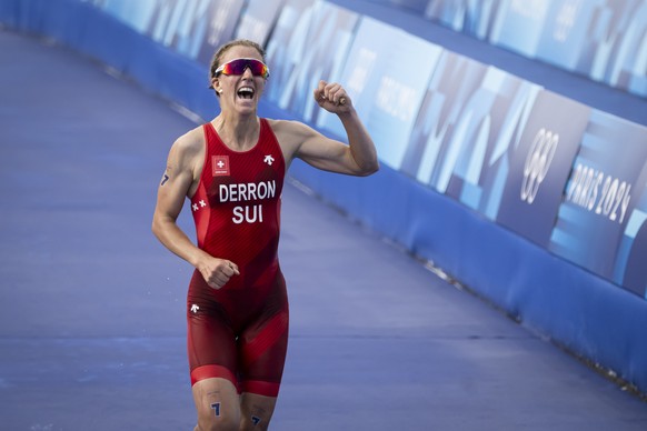 Julie Derron of Switzerland reacts as winner the Silver medal after crossing the finish lineduring the women&#039;s triathlon competition at the 2024 Paris Summer Olympics in Paris, France, Wednesday, ...