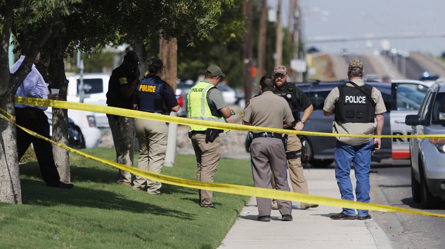 Authorities cordon off a part of the sidewalk in the 5100 block of E. 42nd Street in Odessa, Texas, Saturday, Aug. 31, 2019. Several people were dead after a gunman who hijacked a postal service vehic ...