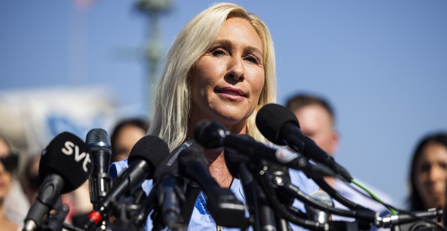 epa12541055 (FILE) - US Republican Representative from Georgia Marjorie Taylor Greene speaks at a press conference with survivors of the Jeffrey Epstein and Ghislaine Maxwell sex-trafficking scandal o ...