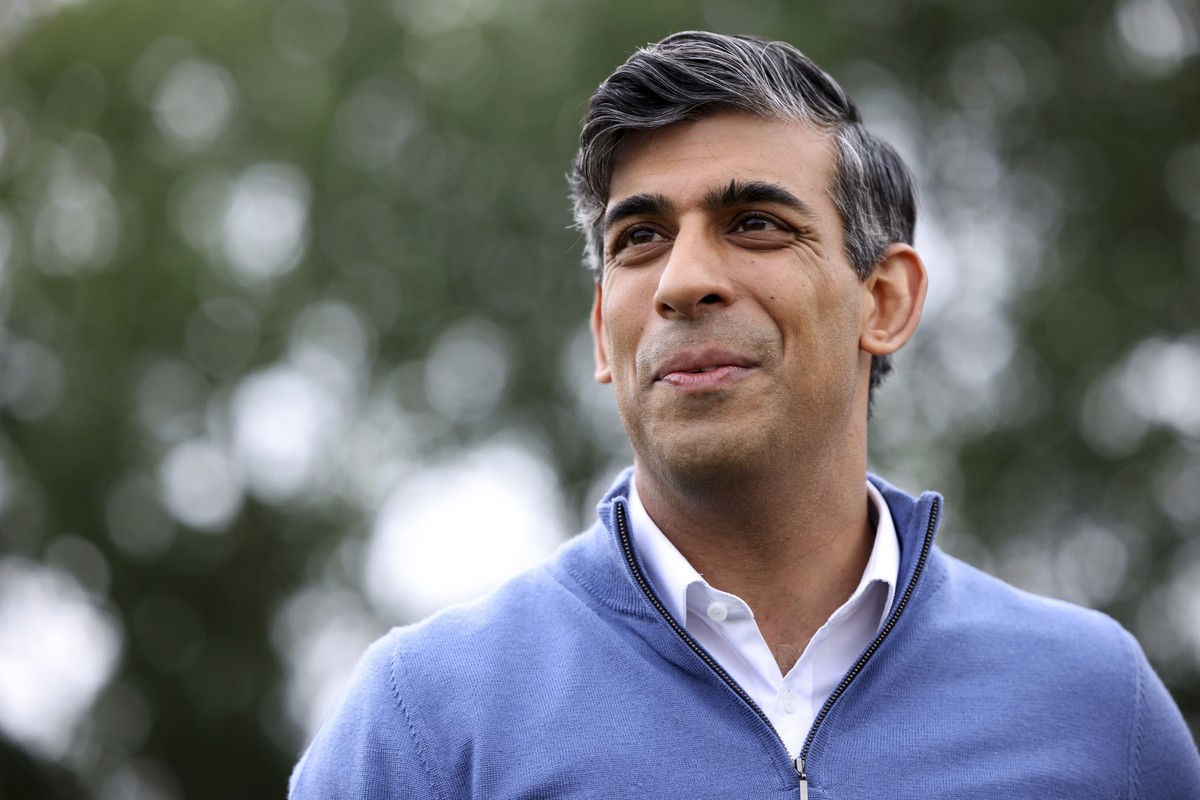 FILE - British Prime Minister Rishi Sunak looks on during his visit to a cricket club as he campaigns in Nuneaton, England, Monday July 1, 2024. U.K. voters are set to cast ballots in a national elect ...