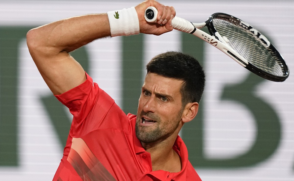 Serbia's Novak Djokovic plays a shot against Japan's Yoshihito Nishioka during their first round match at the French Open tennis tournament in Roland Garros stadium in Paris, France, Monday, ...