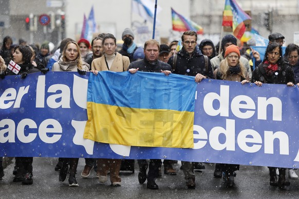 Artem Rybchenko, Ukrainian ambassador to Switzerland, center, Ukrainian politician Maria Mezentseva, center left, and Andri Silberschmidt, Swiss national council, center right, take part in a national ...