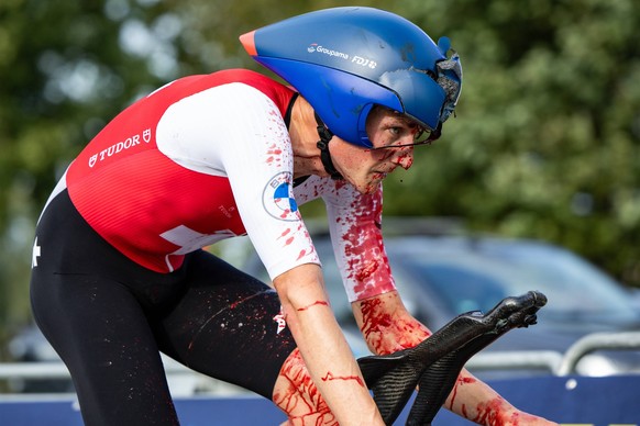 Swiss Stefan Kung of Groupama-FDJ pictured with blood on his white sleeve and face, and a broken helmet, after a heavy fall during the elite men individual time trial at the UEC Road European Champion ...
