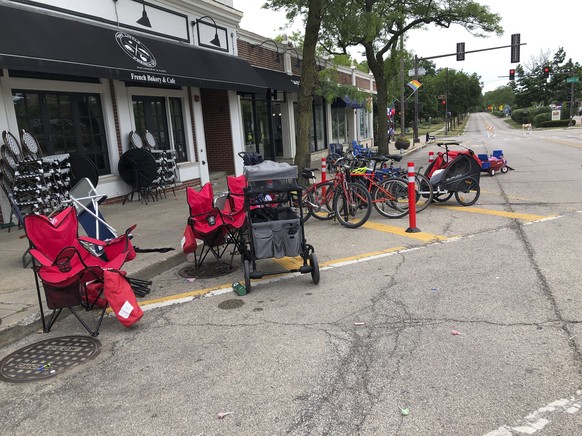 Terrified parade-goers fled Highland Park&#039;s Fourth of July parade after shots were fired, leaving behind their belongings as they sought safety, Monday, July 4, 2022, in Highland Park, Ill. (Lynn ...