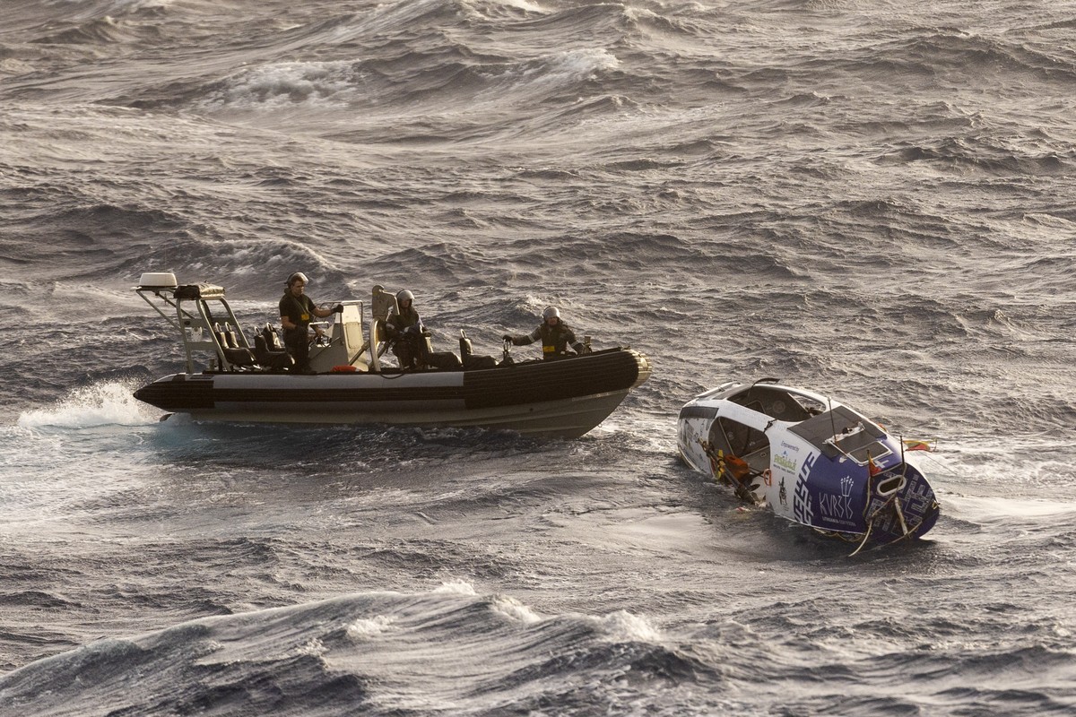 In this photo provided by the Australian Defense Force Australian Navy sailors from HMAS Choules use an inflatable boat to rescue Lithuanian rower Aurimas Mockus, Monday, March 3, 2025, who struck a s ...