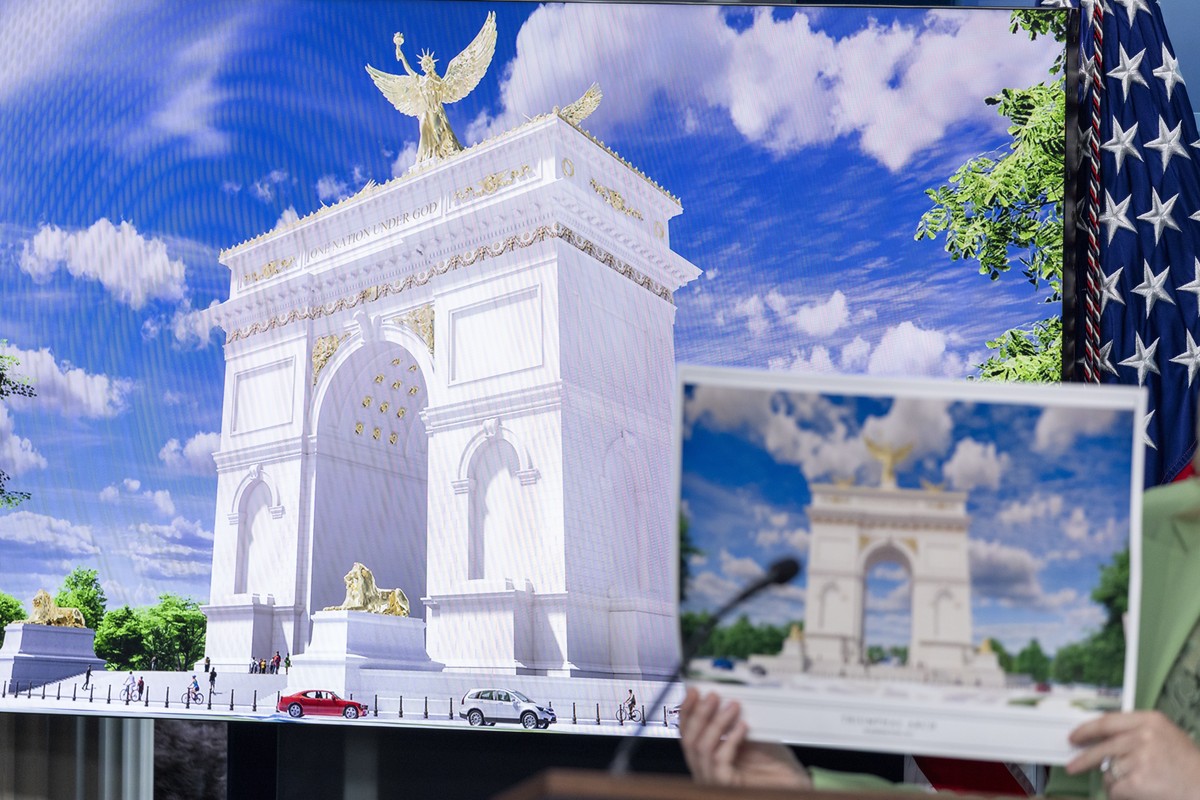 epa12892266 White House Press Secretary Karoline Leavitt holds up an illustration of the Triumphal Arch that President Trump is submitting plans to build during a press briefing at the White House in  ...