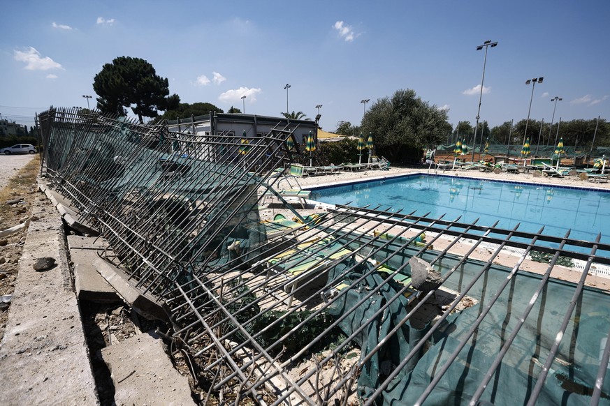 epa12214810 Damage at Villa De Sanctis sports club after an explosion at a petrol station in via dei Gordiani, in Rome, Italy, 04 July 2025. At least 40 people have been injured in the explosion, ANSA ...