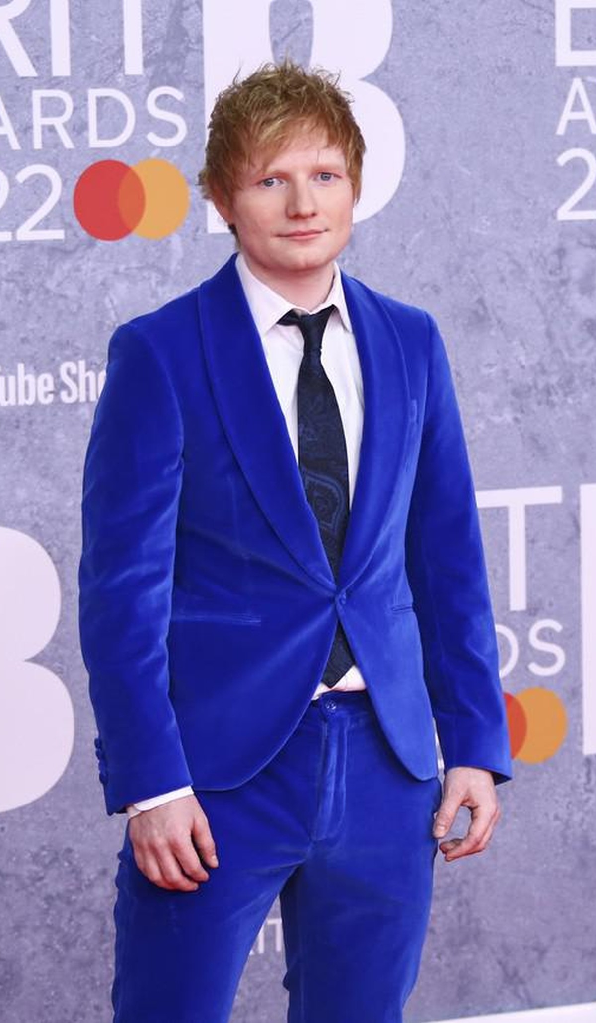 Ed Sheeran poses for photographers upon arrival at the Brit Awards 2022 in London Tuesday, Feb. 8, 2022. (Photo by Joel C Ryan/Invision/AP)