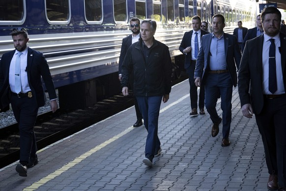U.S. Secretary of State Antony Blinken, center, walks to board a Ukrainian Railways train at Przemysl Glowny train station while traveling to Kyiv, Ukraine, Monday, May 13, 2024, from Przemysl, Poland ...
