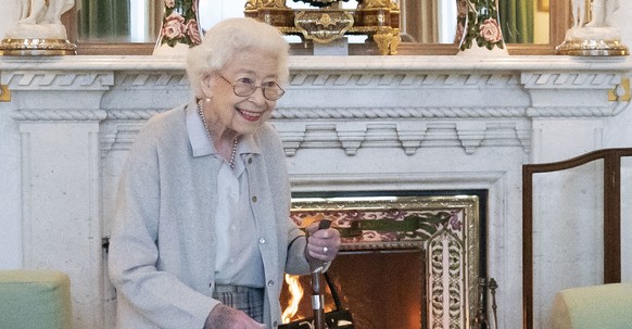 FILE - Britain's Queen Elizabeth II waits in the Drawing Room before receiving Liz Truss for an audience at Balmoral, where Truss was be invited to become Prime Minister and form a new government ...