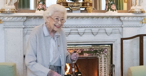 FILE - Britain&#039;s Queen Elizabeth II waits in the Drawing Room before receiving Liz Truss for an audience at Balmoral, where Truss was be invited to become Prime Minister and form a new government ...