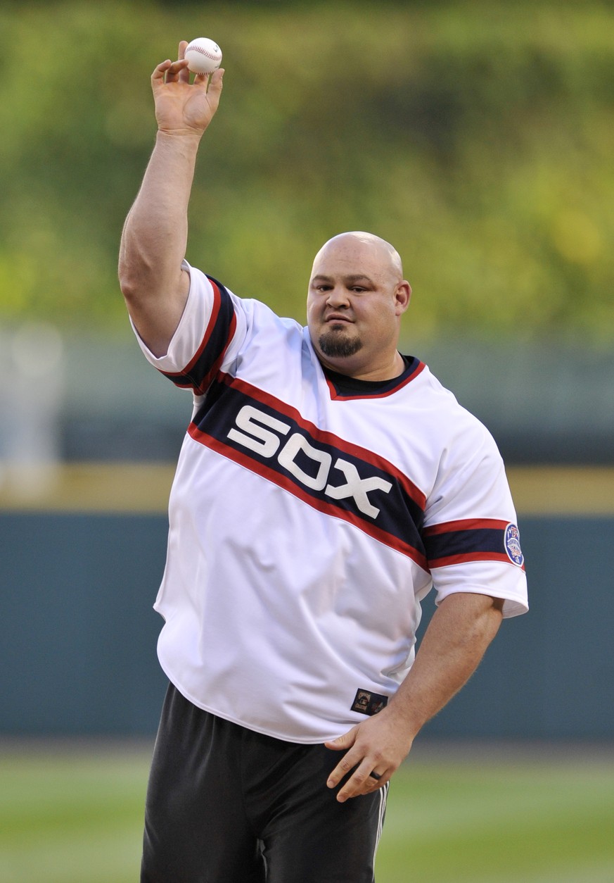 Brian Shaw, winner of the world&#039;s strongest man competition throws out the ceremonial first pitch before a baseball game between the Chicago White Sox and Kansas City Royals Saturday, Sept. 10, 2 ...