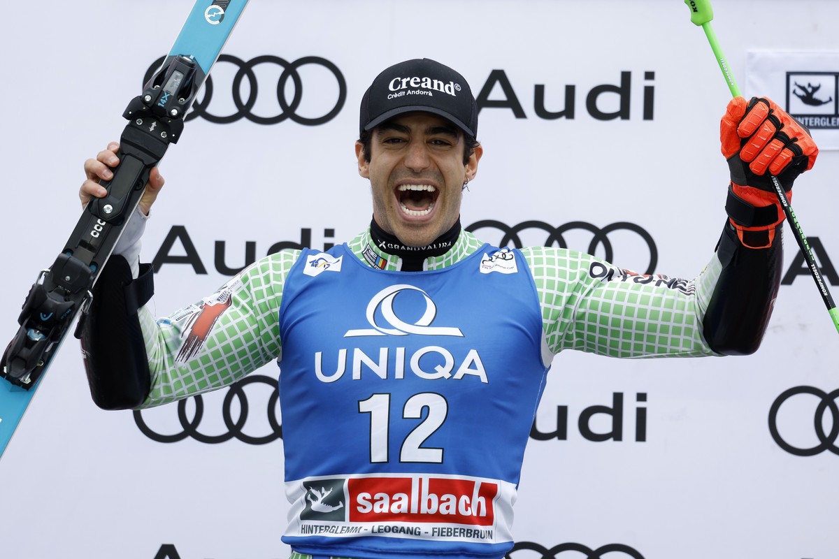 Andorra's Joan Verdu celebrates on the podium after taking second place in an alpine ski, men's World Cup giant slalom race, in Saalbach, Austria, Saturday, March 16, 2024. (AP Photo/Alessan ...