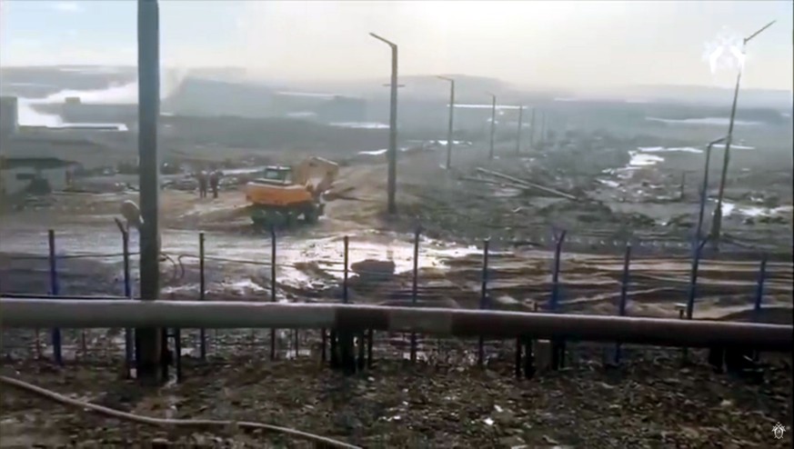 epa08465321 A still image taken from a handout video footage made available 04 June 2020 by the Russian Investigative Committee shows investigators and rescues working at the site of the accident at a ...