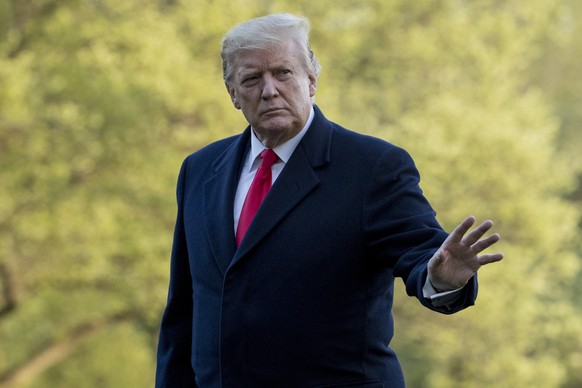 President Donald Trump waves to members of the media as he walks on the South Lawn as he arrives at the White House in Washington, Monday, April 15, 2019, after visiting Minnesota. (AP Photo/Andrew Ha ...