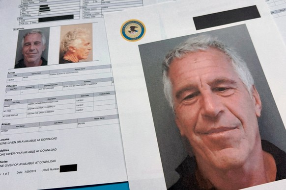 Documents that were included in the U.S. Department of Justice release of the Jeffrey Epstein files are photographed Friday, Jan. 2, 2026. (AP Photo/Jon Elswick)
Justice Department Jeffrey Epstein