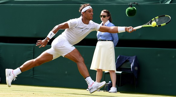 epa06073490 Rafael Nadal of Spain returns to Karen Khachanov of Russia in their third round match during the Wimbledon Championships at the All England Lawn Tennis Club, in London, Britain, 07 July 20 ...