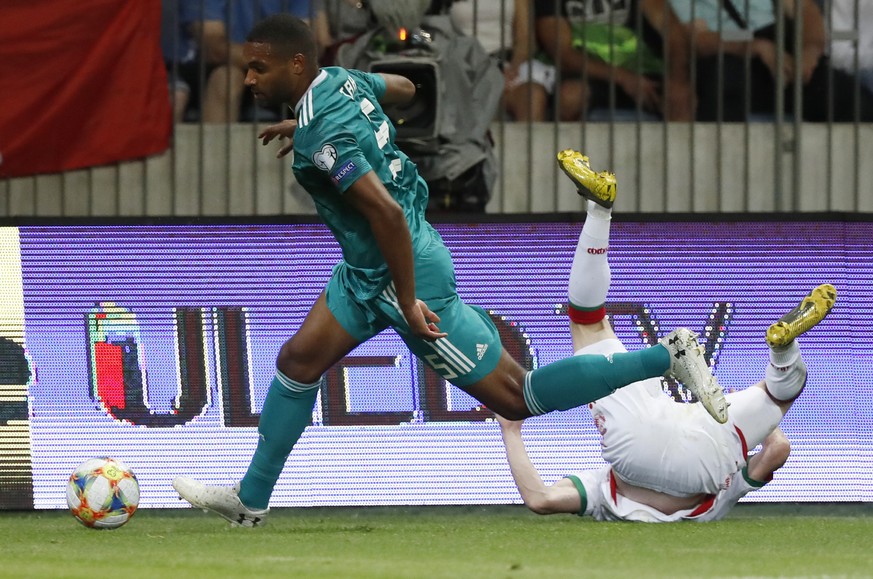 Germany&#039;s Jonathan Tah, left, fights for the ball with Belarus&#039; Yury Kavalev during the Euro 2020 group C qualifying soccer match between Belarus and Germany at the Borisov-Arena in Borisov, ...