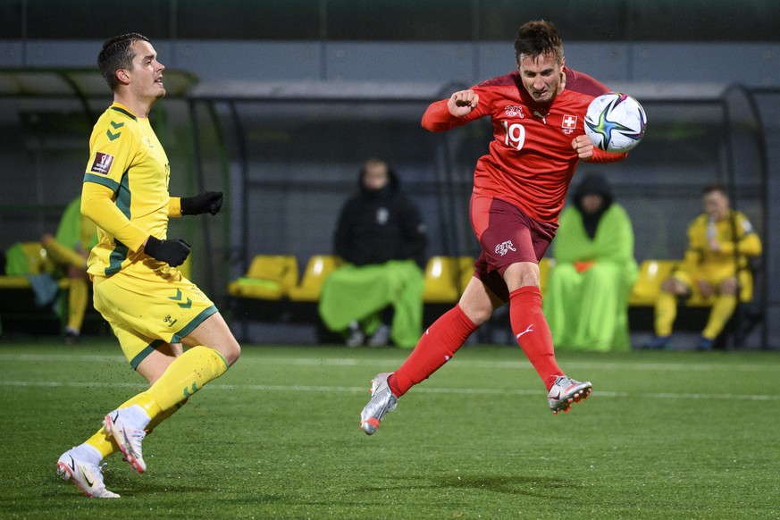 Switzerland&#039;s forward Mario Gavranovic, right, scores the fourth goal in front of Lithuania&#039;s defender Rolandas Baravykas, left, during the 2022 FIFA World Cup European Qualifying Group C so ...