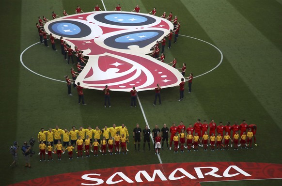 The teams of Sweden, left, and England stand for the national anthems before the quarterfinal match between Sweden and England at the 2018 soccer World Cup in the Samara Arena, in Samara, Russia, Satu ...