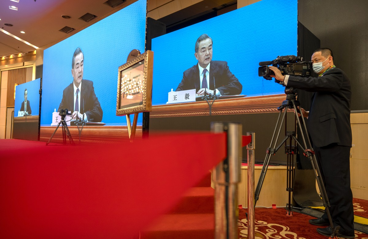 Chinese Foreign Minister Wang Yi speaks during a remote video press conference held on the sidelines of the annual meeting of China's National People's Congress (NPC) in Beijing, Sunday, Mar ...