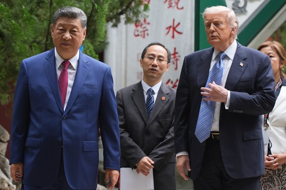 President Donald Trump talks with China's President Xi Jinping at the Zhongnanhai leadership compound, Friday, May 15, 2026, in Beijing. (AP Photo/Mark Schiefelbein, Pool)
Trump China