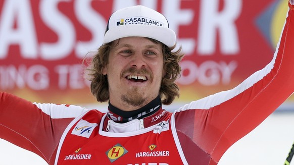 Austria&#039;s Manuel Feller celebrates taking third place in an alpine ski, men&#039;s World Cup slalom, in Meribel, France, Sunday, March 20, 2022. (AP Photo/Alessandro Trovati)