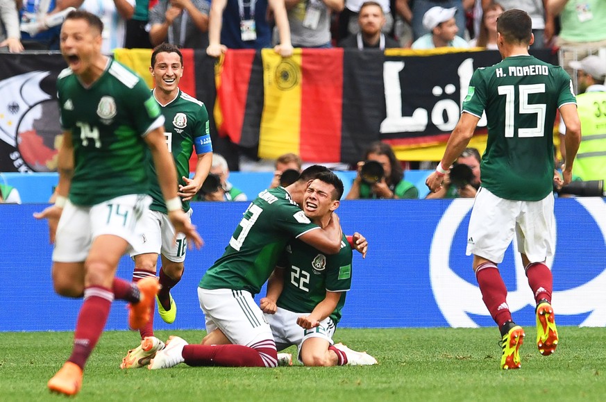 epa06816177 Hirving Lozano (C-R) of Mexico celebrates with his teammates after scoring the 1-0 lead during the FIFA World Cup 2018 group F preliminary round soccer match between Germany and Mexico in  ...