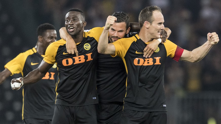 YB&#039;s Sekou Sanogo, Marco Buerki and Steve von Bergen react after winning the UEFA Champions League third qualifying round, second leg match between Switzerland&#039;s BSC Young Boys and Ukraine&# ...