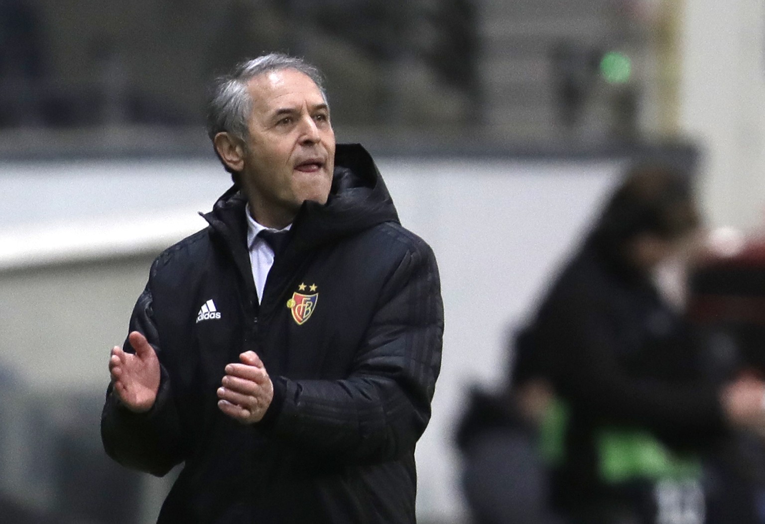 Basel&#039;s head coach Marcel Koller reacts as he watches the game during a Europa League round of 16, 1st leg soccer match between Eintracht Frankfurt and FC Basel in Frankfurt, Germany, Thursday, M ...