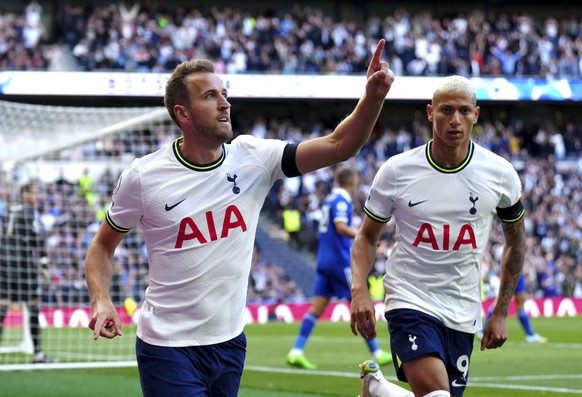 Tottenham Hotspur&#039;s Harry Kane, left, celebrates scoring his side&#039;s opening goal during the English Premier League soccer match between Tottenham Hotspur and Leicester City at Tottenham Hots ...