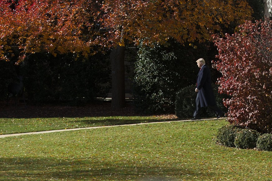 epa06357965 US President Donald J. Trump walks to board Marine One on the South Lawn of the White House in Washington, DC, USA, 29 November 2017. President Trump is departing the White House for a tax ...