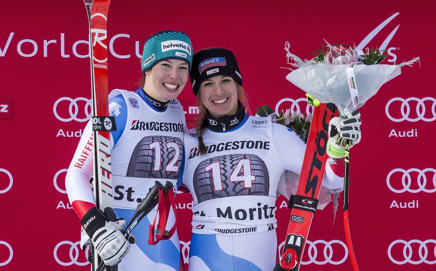 epa06378620 Jasmine Flury, of Switzerland, right, first place, and Michelle Gisin, left, of Switzerland, second place, celebrate on the podium in the finish area at the women&#039;s Super-G race at th ...