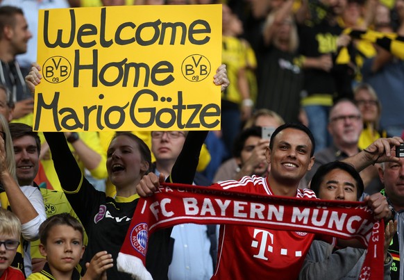 epa05484232 Fans prior the German DFL Super Cup match between Borussia Dortmund and Bayern Munich in Dortmund, Germany, 14 August 2016. EPA/Ina Fassbender