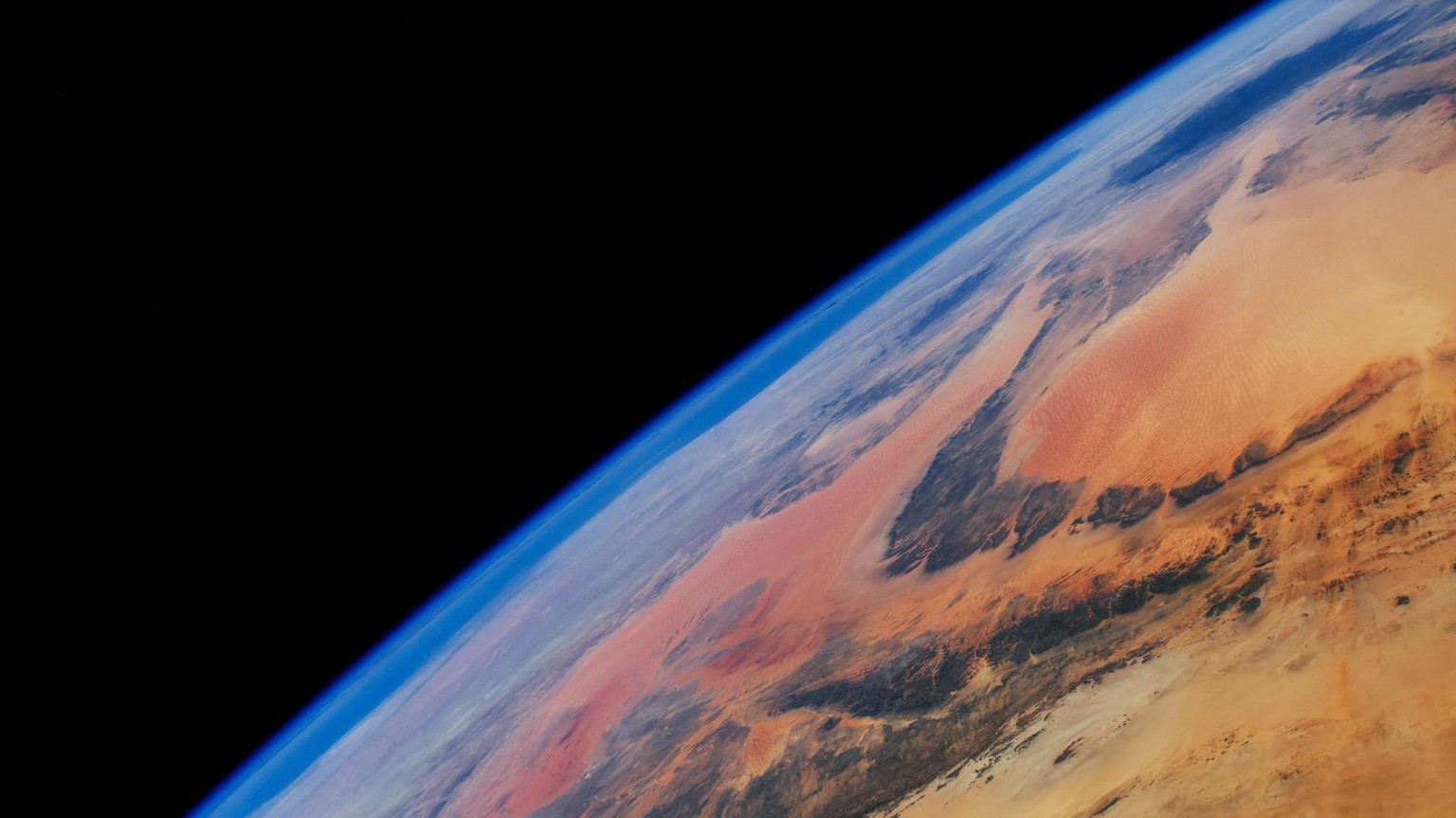 The vast Libyan Desert stretches toward the Mediterranean Sea, which itself fades into the horizon of this photograph. This highly oblique view of Northern Africa was taken by an External High-Definit ...