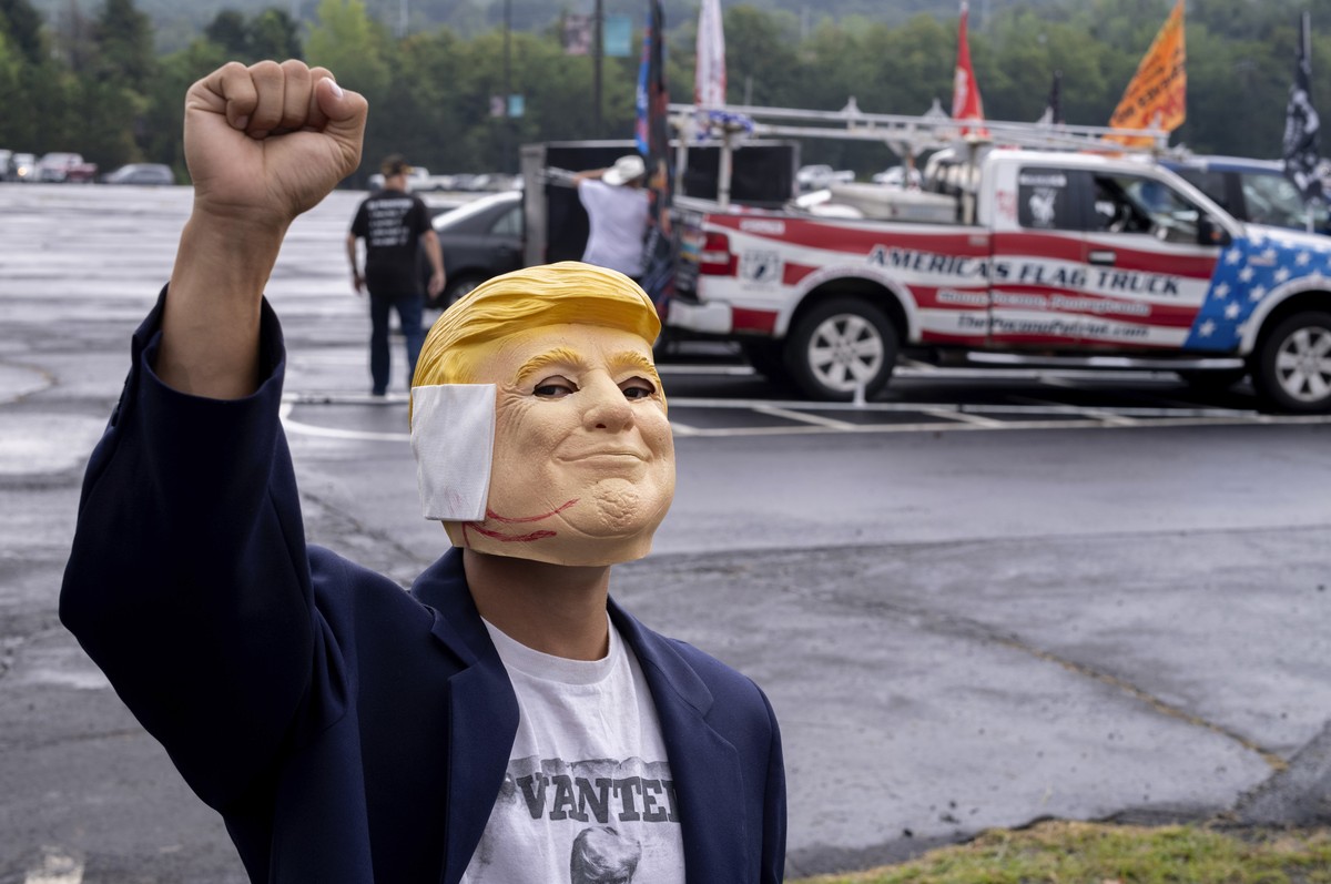 "Breakdancer for Trump" Victor Moon poses in a Donald Trump mask before campaign rally for Republican presidential nominee former President Trump at the Mohegan Sun Arena at Casey Plaza in W ...