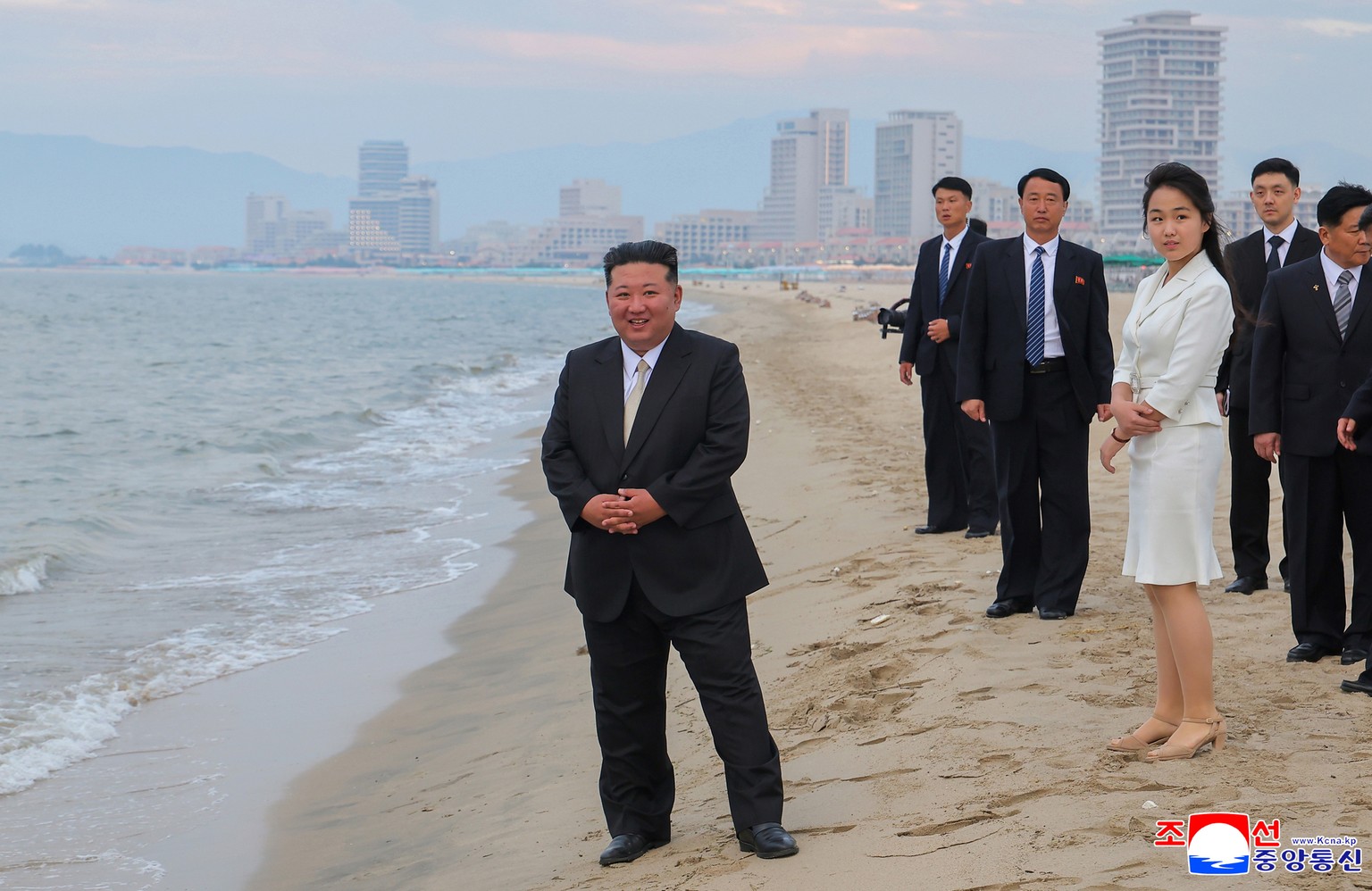 epaselect epa12197959 A photo released by the official North Korean Central News Agency (KCNA) shows North Korean leader Kim Jong Un (L) and his daughter Kim Ju Ae (3-R) standing on a beach during a c ...