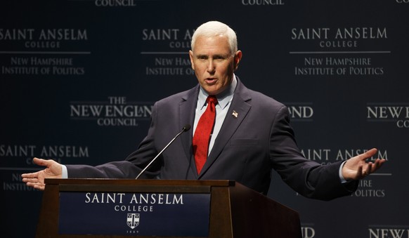 epa10125700 Former US Vice President Mike Pence addresses an audience during a visit to the 'Politics and Eggs,' business gathering of the New Hampshire Institute of Politics, at St Anselm College in  ...